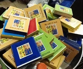 A pile of Eazi Education ABC illustration books